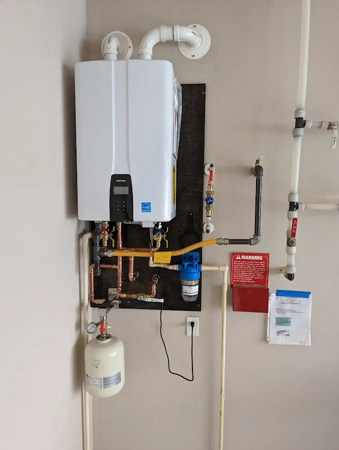 Professional plumber installing copper piping in a Bunnell home